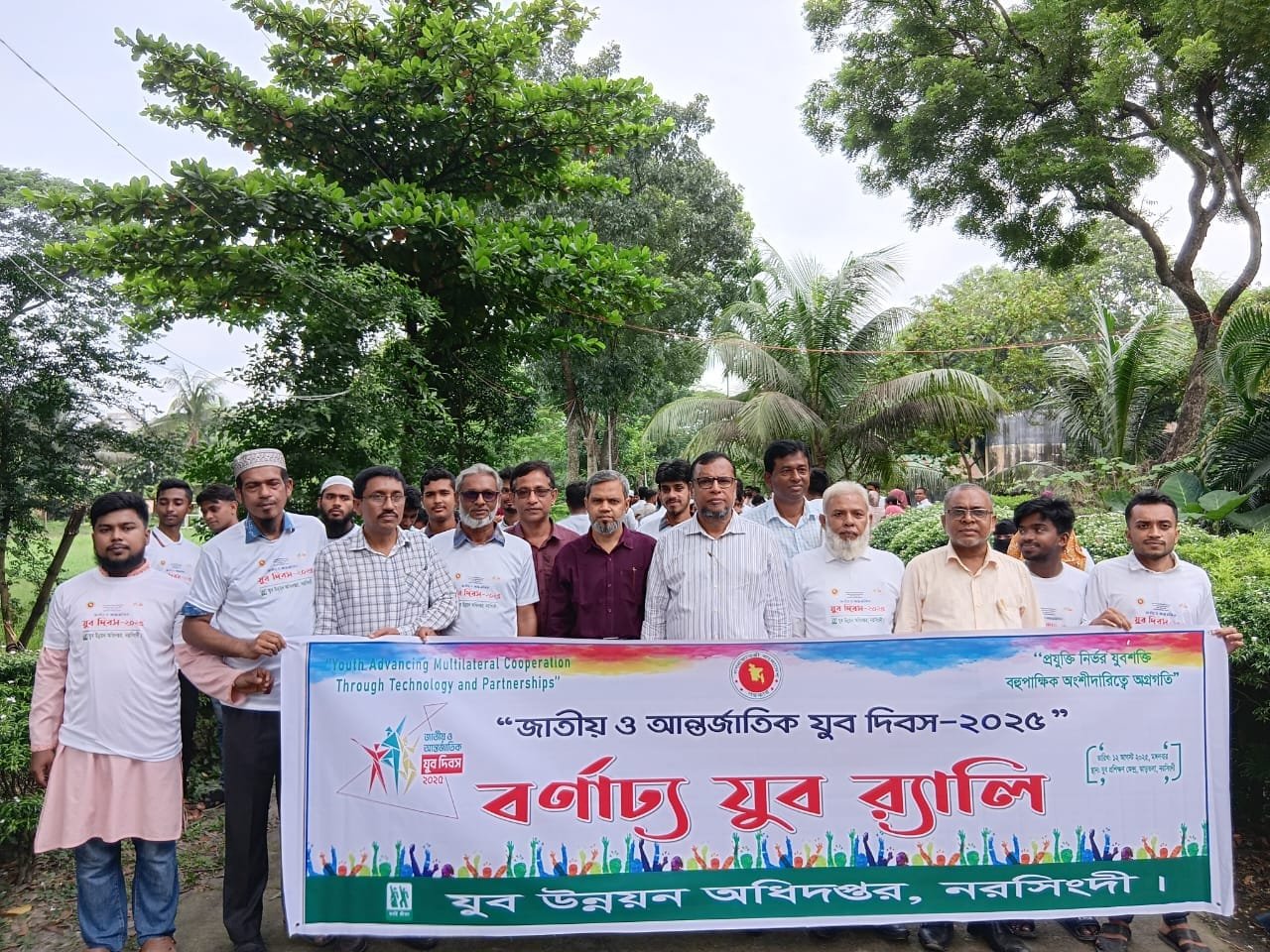 Youth rally group with banner.